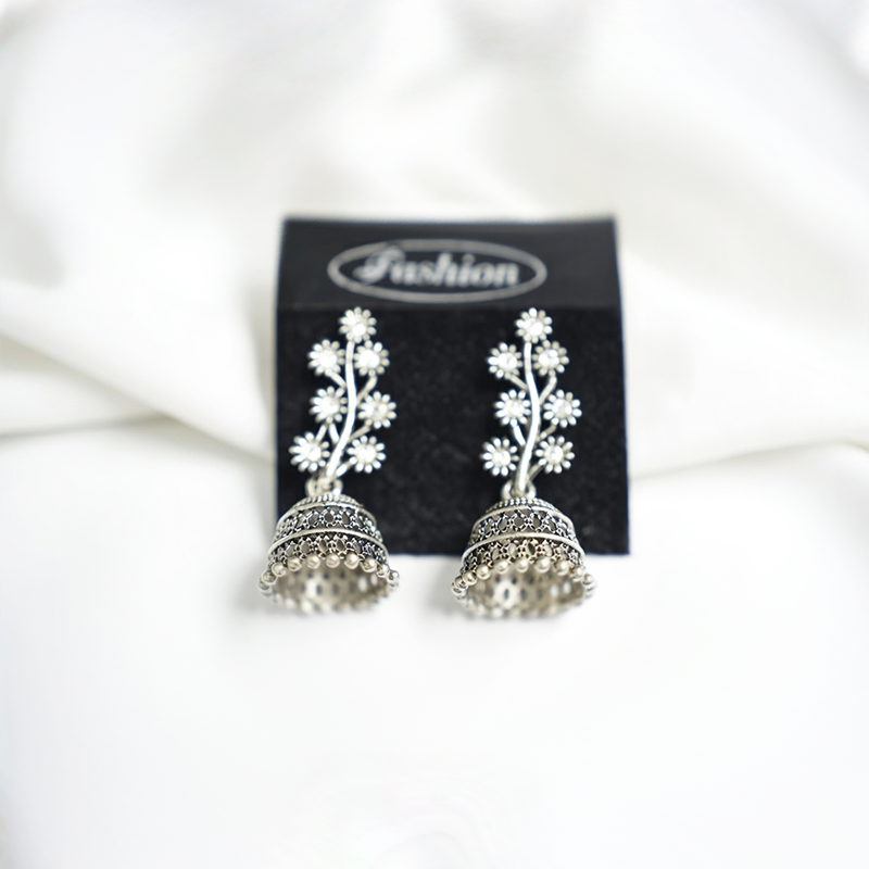 Traditional Antique Silver Toned Floral Studded Jhumka Earrings With Crystal Accents