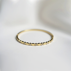 Gold Toned Bangle Style Bracelet With Sparkling Cubic Zirconia Stones In Bezel Dots
