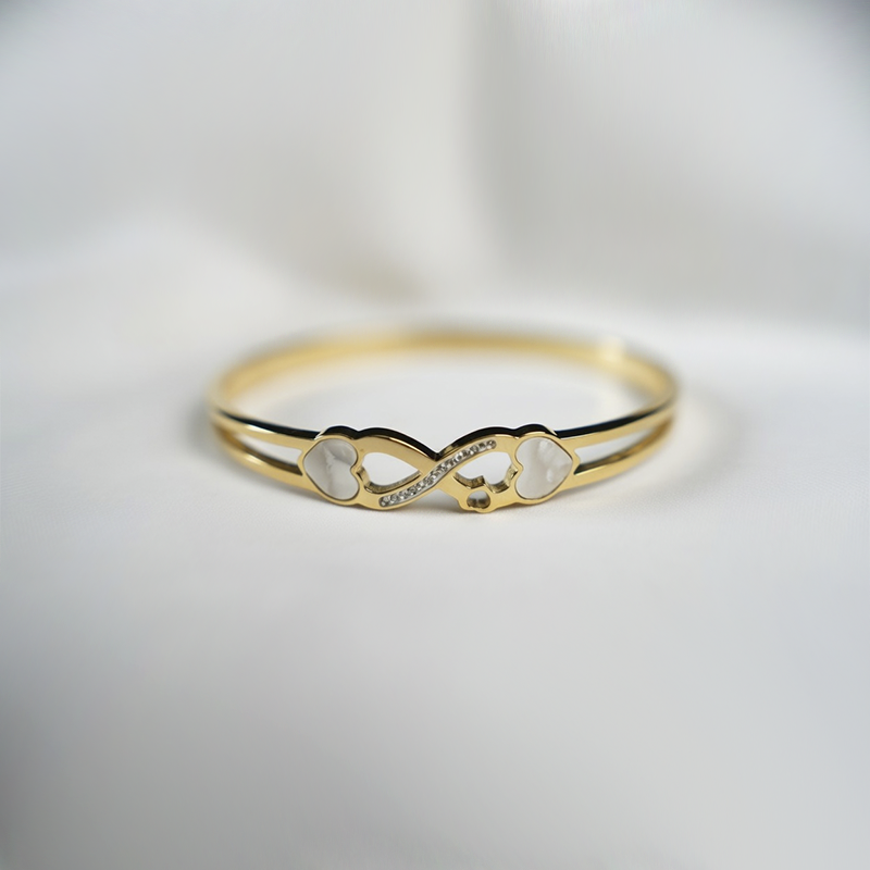 Gold-Plated Stainless Steel Infinity Bracelet With Heart Shapes & Cubic Zirconia Stones