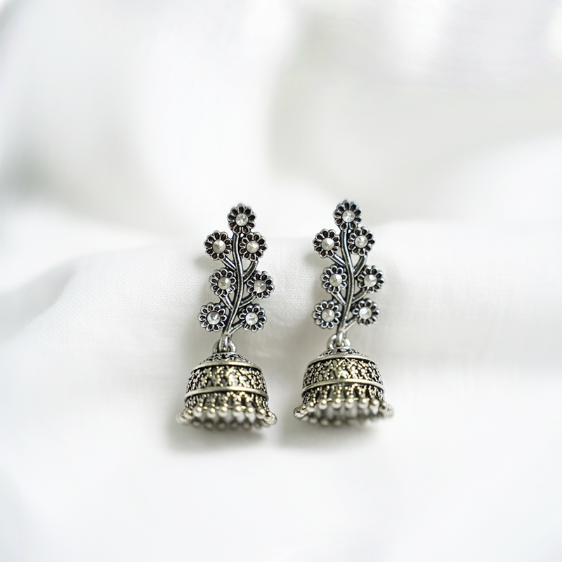 Traditional Antique Silver Toned Floral Studded Jhumka Earrings With Crystal Accents
