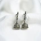 Traditional Antique Silver Toned Floral Studded Jhumka Earrings With Crystal Accents